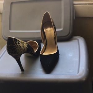 Black and gold pumps